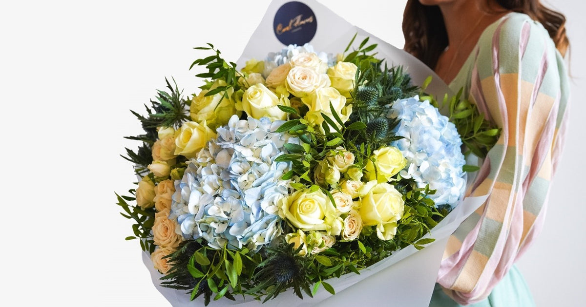 True Elegance bouquet of blue hydrangea and white roses by Coral Flowers London