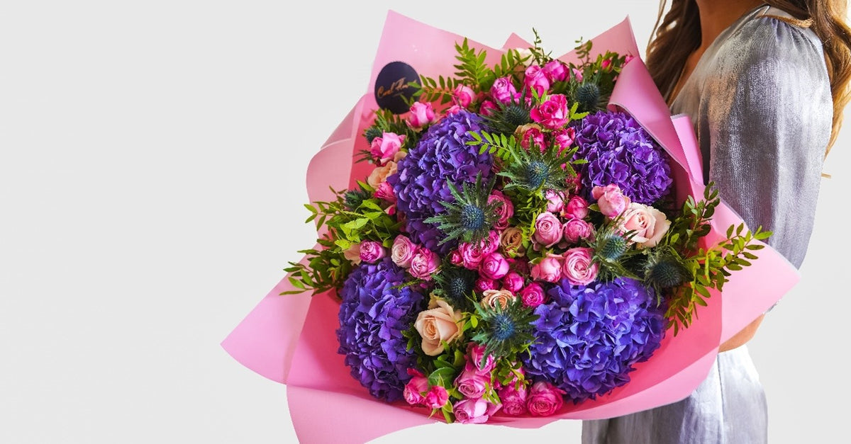 Purple hydrangea and pink rose bouquet by Coral Flowers London