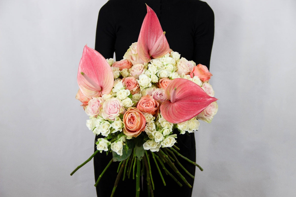 Travelo bouquet of white calla lilies and white roses by Coral Flowers London