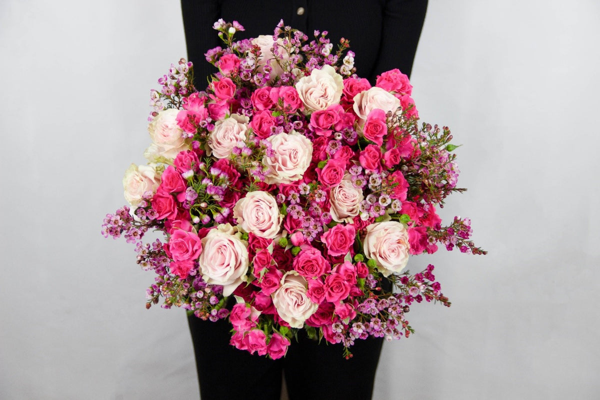 Lola bouquet of white Avalanche roses and pink spray roses by Coral Flowers London