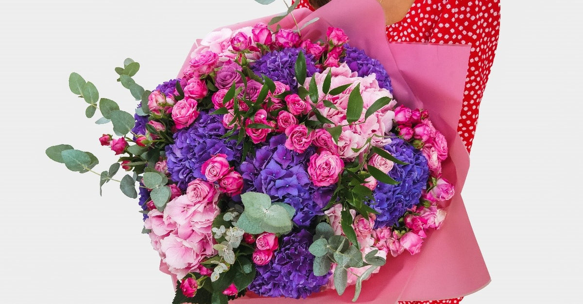 Infinity Love bouquet of pink and purple hydrangea with spray roses by Coral Flowers London