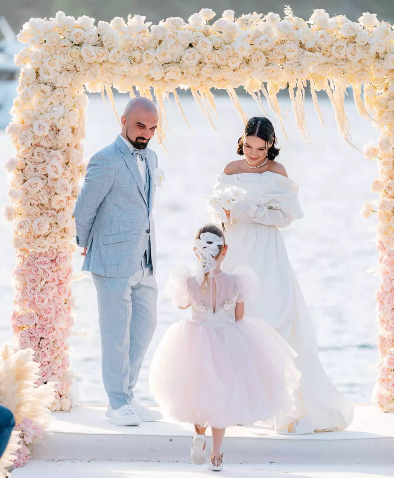 Wedding ceremony arch by Coral Flowers